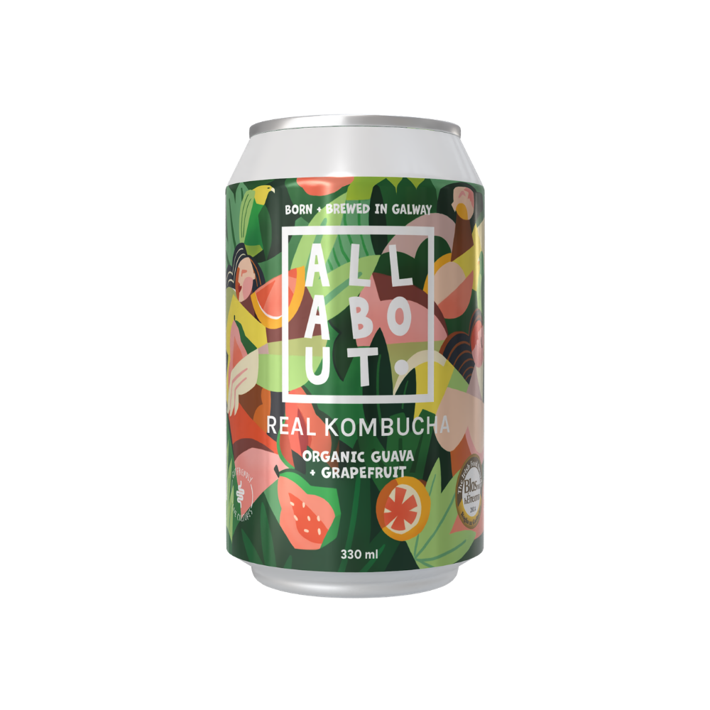 A 330 ml aluminum can of All About Real Kombucha Organic Guava + Grapefruit, featuring a colorful tropical fruit illustration on a dark green background.