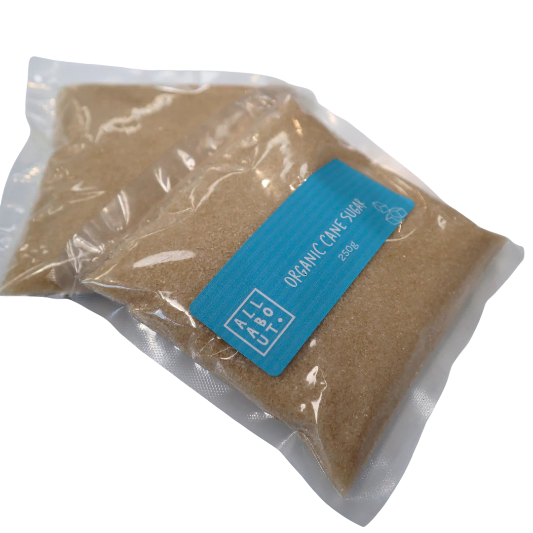 All About Kombucha 250g pouch of organic cane sugar in clear vacuum-sealed packaging with a blue label, ideal for kombucha brewing.