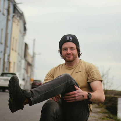 All About Kombucha Co-Founder Emmett Kerrigan wearing black branded warm cotton beanie on the Long Walk in Galway City Centre